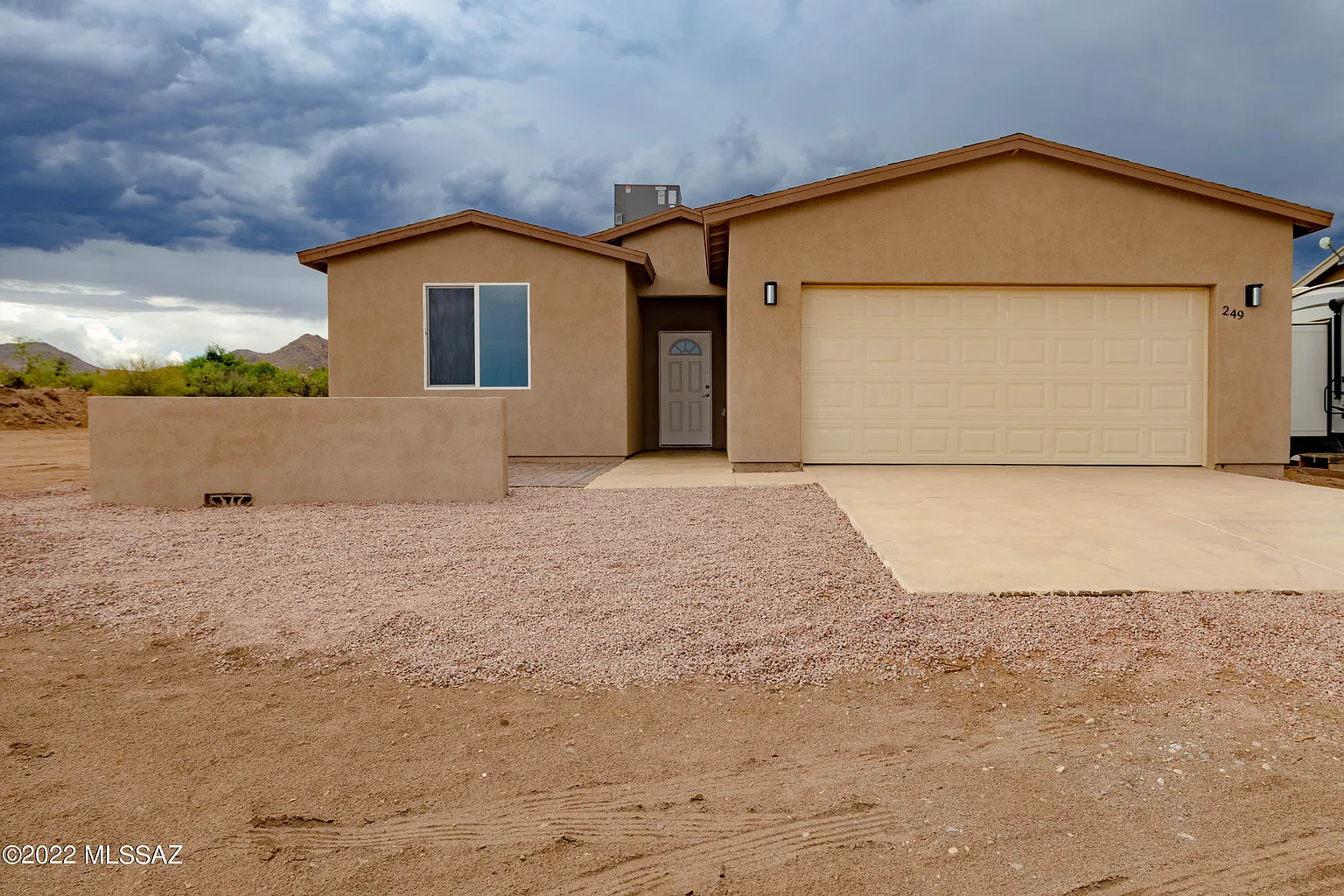 Custom built home exterior with attached garage in Arizona
